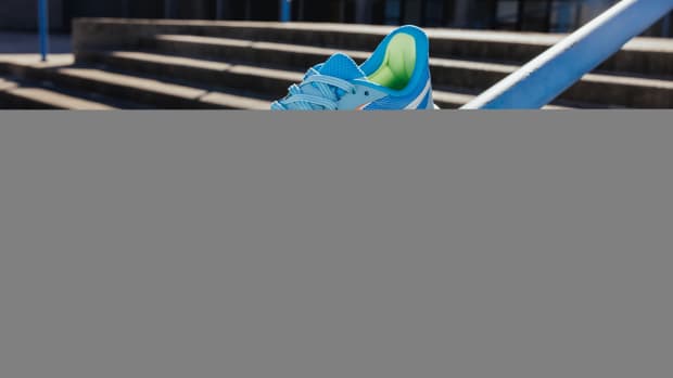 View of blue and white Reebok shoe.